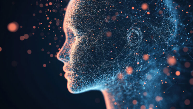 Stylised human profile made of interconnected blue lines and orange light particles, symbolising AI narratives.